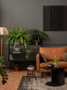 Interior design of living room interior with mock up poster frame, brown sofa, plants, glass sideboard, black coffee table, Royalty Free Stock Photo