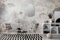 Interior design of loft industrial apartment with white chair, black round coffee table, modern mirror, simple lamp, patterned