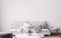 Interior design of luxury living room with stylish sofa, purple vase , and elegant accessories Royalty Free Stock Photo