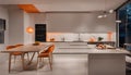 Interior design of minimalist kitchen integrated with dining area with orange lights at night Royalty Free Stock Photo