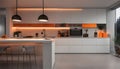 Interior design of minimalist kitchen integrated with dining area with orange lights at night Royalty Free Stock Photo