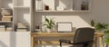 Interior design of a minimalist white home working room with laptop mockup on a wooden table Royalty Free Stock Photo