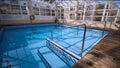 Interior design for a pool with steel railings and wooden berms Royalty Free Stock Photo