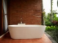 interior design white bathroom brick wall room with brown tiles on the floor Royalty Free Stock Photo