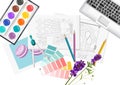 Interior designer desk with pantone color formula guide, keyboard, sketch, watercolor paint and compass