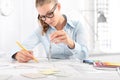 interior designer draws at desk in office, with pencil and compass, Planning Concept Royalty Free Stock Photo