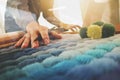 Interior designer hand choosing carpet sample Royalty Free Stock Photo