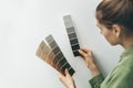 Interior designer selecting wall paint color from samples Royalty Free Stock Photo