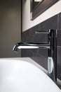 Interior detail of bathroom with washbasin and faucet. Bathroom interior sink with gray tiled wall and mirror modern Royalty Free Stock Photo