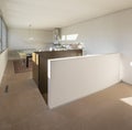 Interior detail of nmodern house in Switzerland, showing the kitchen and dining room with table and chairs