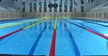 Interior details of lanes and seating in Olympic sized swimming pool