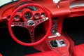 Interior details of red sports car steering wheel speedometer Royalty Free Stock Photo
