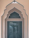 Interior diminishing perspective view with gable partitions wall inside Bang O mosque leading into glass wall