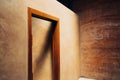 Interior door design of neat cob house in concept of light and earth. Royalty Free Stock Photo