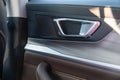 interior door handle of a modern premium car close-up