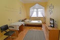 Interior of the double hotel room with a portrait of the Russian poet A.S. Pushkin on a wall