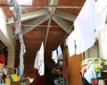 interior of a dusty attic with hanged tatters and rags Royalty Free Stock Photo