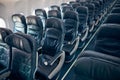 Interior of economy coach seats inside of passenger airplane Royalty Free Stock Photo