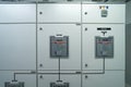 Interior of electrical room. Power energy motor machinery cabinets in control or server room, main operator station network and Royalty Free Stock Photo