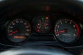 Interior element of Toyota Caldina car of 2000 release in the back of a silver T210 station wagon in a parking lot with a green