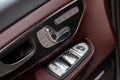 The interior elements of a new expensive business Mercedes V-class car inside with windows and seats buttons and the leather with