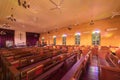 Interior of empty christian church with cross, architecture design. Religious beliefs. Catholic religion. Jesus worship