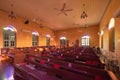 Interior of empty christian church with cross, architecture design. Religious beliefs. Catholic religion. Jesus worship