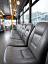 Interior of an empty city bus with rows of leather seats. Royalty Free Stock Photo