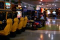 Interior of an empty darkened amusement arcade hall