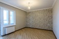 The interior of an empty, freshly renovated room in a new building without furniture