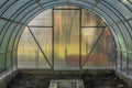 Interior of empty greenhouse before spring with concrete walls Royalty Free Stock Photo