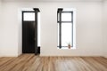 Interior of an empty loft device with separate door and window, metal pillars and wooden platforms and a small aloe Royalty Free Stock Photo