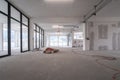 Interior empty office light room in a new building renovation or under construction. Glass doors and Windows Royalty Free Stock Photo