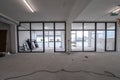 Interior empty office light room in a new building renovation or under construction. Glass doors and Windows Royalty Free Stock Photo