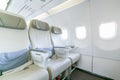 Interior of empty ready to fly airliner cabin with rows of seats