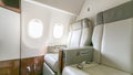 Interior of empty ready to fly airliner cabin with rows of seats.