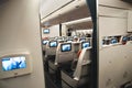 Interior of empty ready to fly airliner cabin with rows of seats