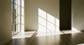Interior of an Empty Room with Sunlight Streaming Through a Large Window Casting Geometric Shadows Royalty Free Stock Photo