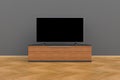 Interior of empty room with TV, Living room led tv on gray wall with wooden table modern loft style Royalty Free Stock Photo