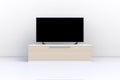 Interior of empty room with TV, Living room led tv on white wall with wooden table modern loft style Royalty Free Stock Photo