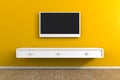 Interior of empty room with TV, Living room led tv on yellow wall with wooden table modern loft style Royalty Free Stock Photo