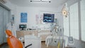 Interior of empty stomatology orthodontist office room equipped with x ray on monitors