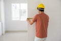 Interior engineer measure new house wall Royalty Free Stock Photo