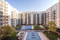 Interior facade of a block patio with communal pools covered