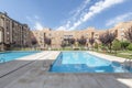 Interior facades of a block patio of residential buildings with gardens and summer swimming pools with gardens and decorative