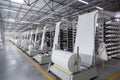 Interior of a factory workshop for the production of polypropylene bags. Racks with rolls and coils.