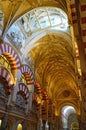 The famous double archways and vaulted ceiling at the Mezquita Cordoba, Andalucia, Spain