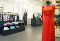 Interior of fashionable women`s clothes store with clothes racks