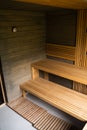 Interior of Finnish sauna, classic wooden sauna with hot steam. Wooden interior baths, wooden benches and loungers, spa Royalty Free Stock Photo