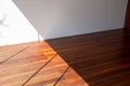 Interior flooring cumaru wood texture in sun light and shadow contrast Royalty Free Stock Photo